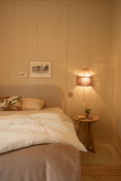 Washed linen sheets and a cosy atmosphere in the double bedroom of this holiday home in Brittany