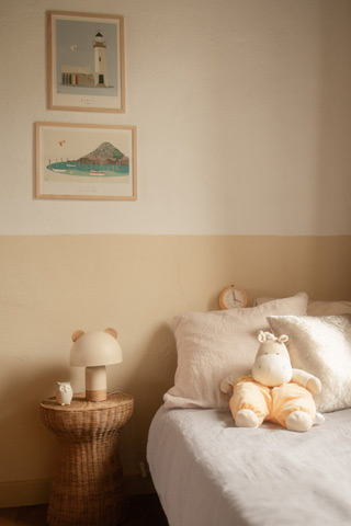 Single bed for children, bedside table, and sweet decor