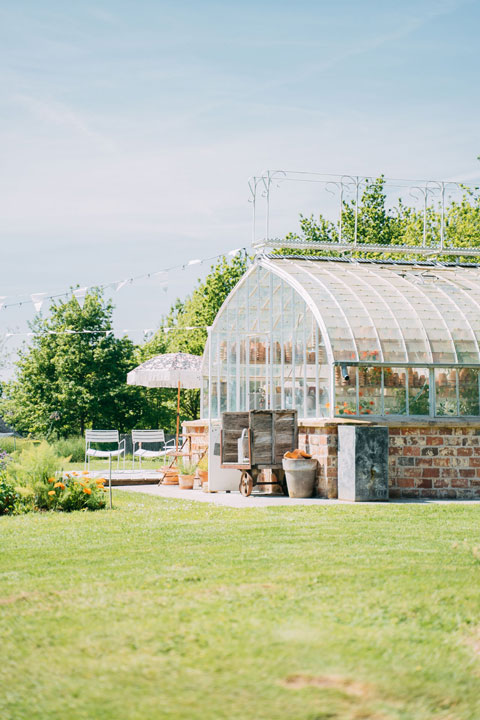 Old-fashioned greenhouse, vegetable patch, and garden with a terrace at your holiday home.